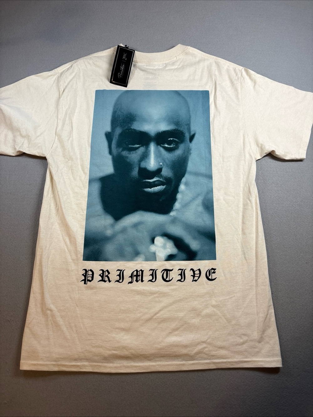 Tupac Primitive Cream Short Sleeve Tee with Blue Portrait Graphic